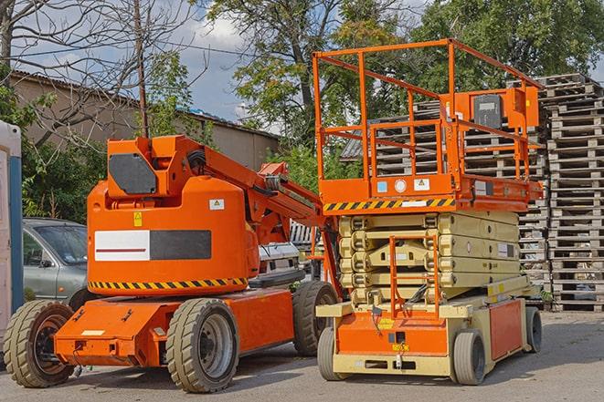 forklift moving crates in a large warehouse in Bazetta